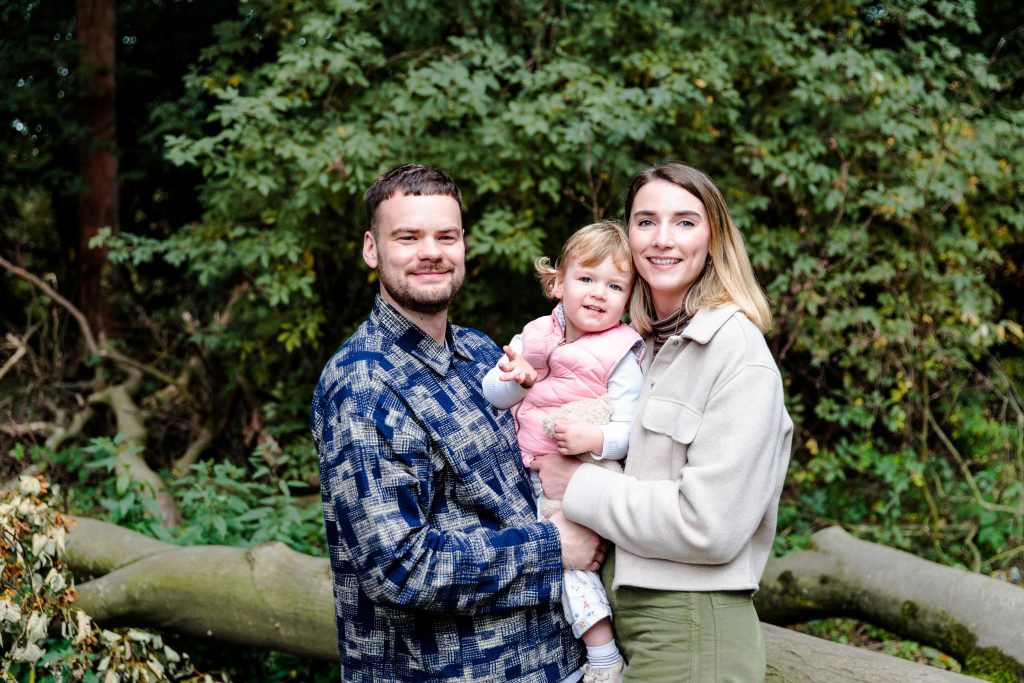 Young Family pose during a portrait session at Roundhay Park
