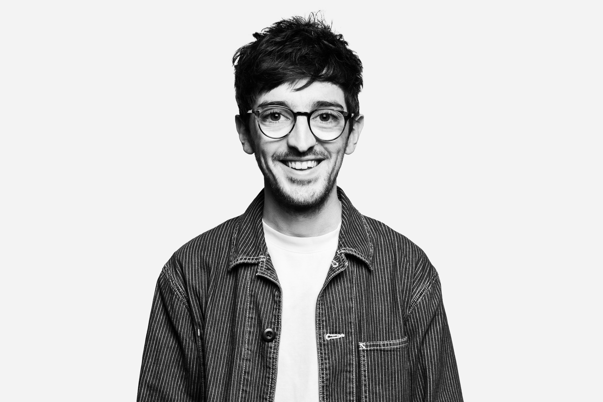 Web Designer and Coder stands for Headshot photo in black and white.